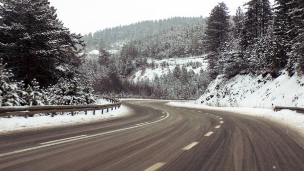 istock Driving through the snowy landscape in the mountains 1191340247