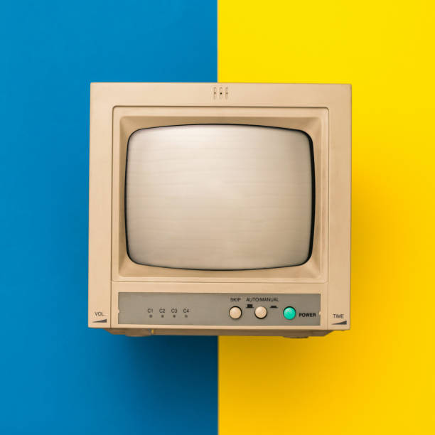 istock Retro TV on yellow and blue background. Vintage electronics. 1191340361
