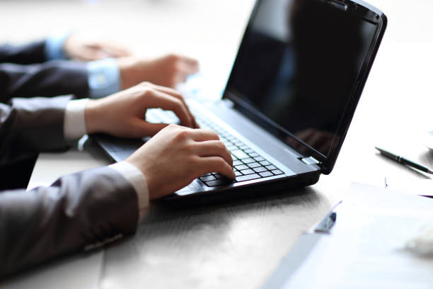 istock close up.businessman typing text on laptop. people and technology 1191344299