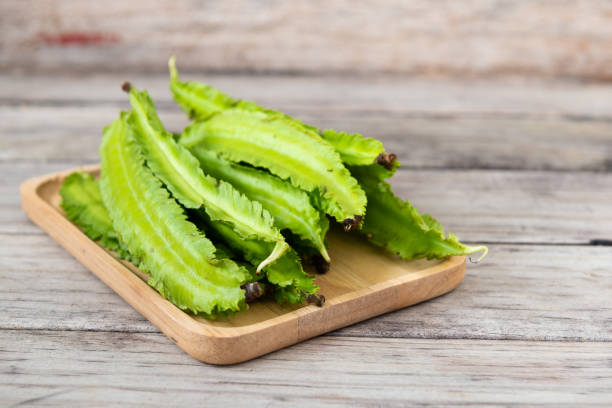istock Psophocarpus tetragonolobus, Winged Bean on wood table 1191344582