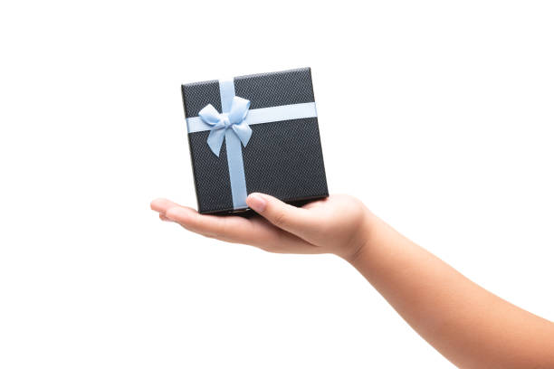 istock Girl Hand Hold Gift box with blue ribbon isoalted on white 1191345775