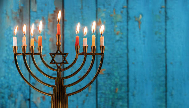 jewish holiday hanukkah with menorah traditional candelabra - candle hanukkah menorah candlelight imagens e fotografias de stock