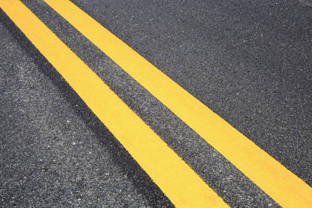 istock Traffic line on road with texture. 1191347715