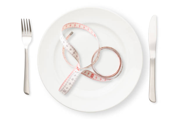 istock Place setting with measuring tape on white background 1191348111