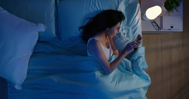istock woman use smartphone on bed 1191350088
