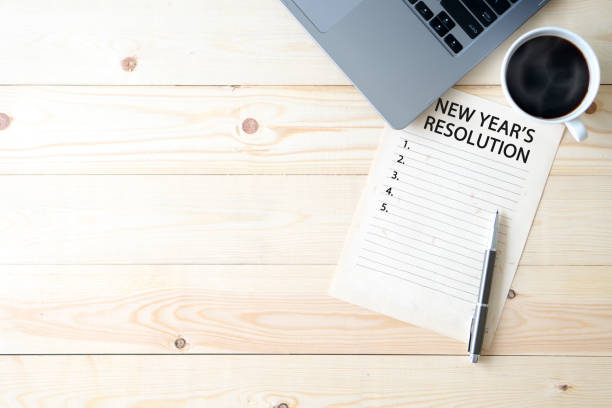 istock Top view wooden office New Year Resolutions 1191354084
