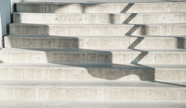 istock white grey staircase cement with black shadow architecture background 1191356200