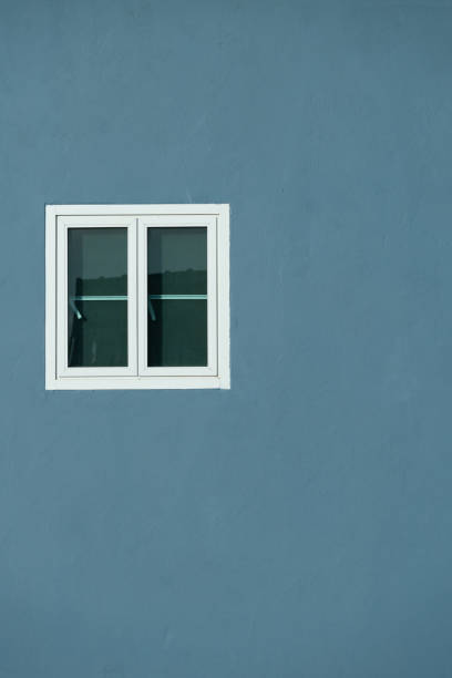 istock exterior white glass window on blue cement wall architecture background 1191356211