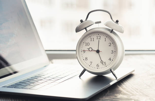 istock Work time concept. Home office with laptop, graph and alarm clock 1191358378