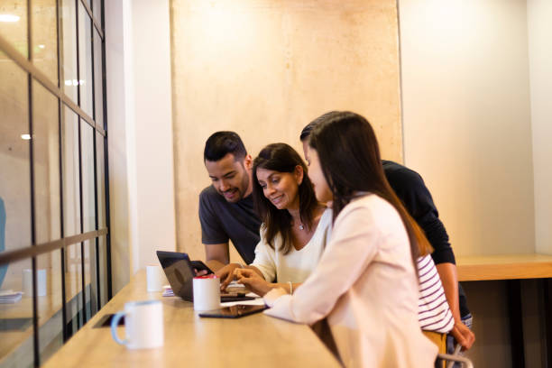 istock Group of people talking about some kind of work at the office 1191359624