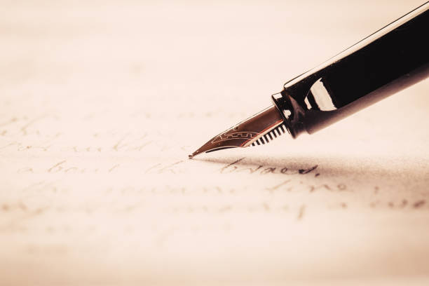 istock fountain pen on paper with ink text closeup 1191360940