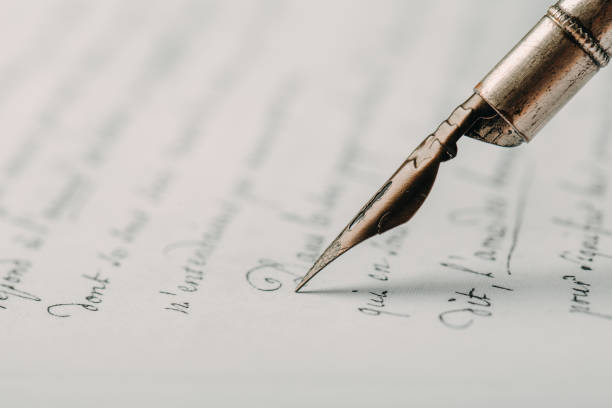 istock fountain pen on paper with ink text closeup 1191360998