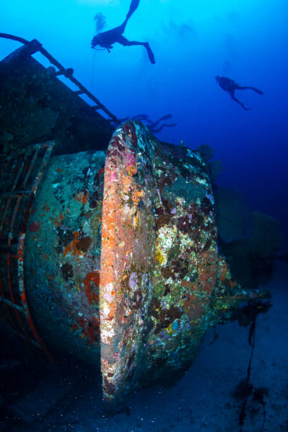 istock SCUBA divers exploring a large underwater shipwreck in Thailand 1191361178