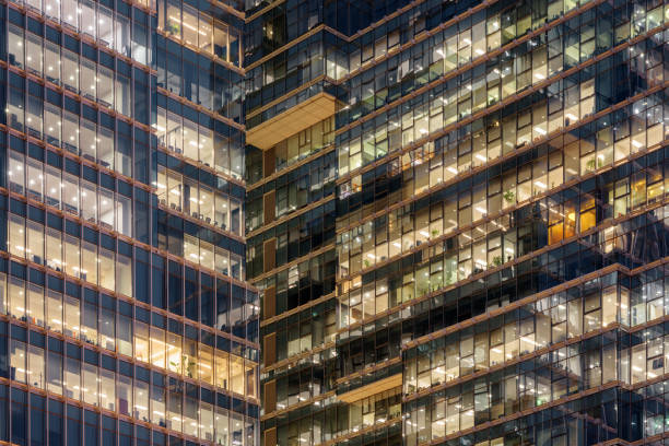istock Glowing windows of skyscrapers. Modern office buildings 1191361868