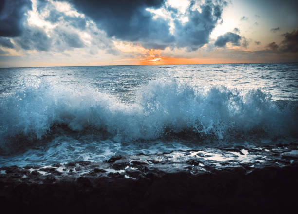 istock Ocean wave on the beach at sunset time 1191364844