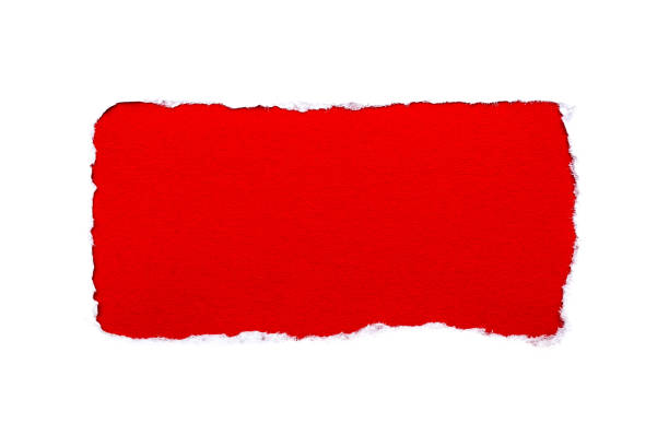 istock A hole in white paper with torn edges isolated on a white background with a bright red color paper background inside. Good paper texture. 1191365059