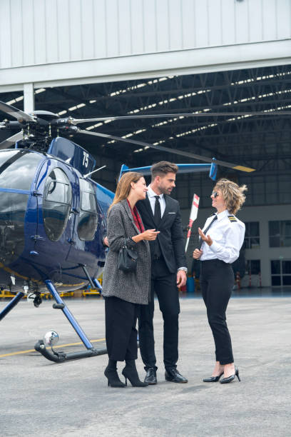 istock Enterprising women and men preparing their helicopter trip 1191365654