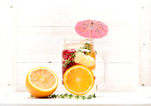 Summer lemonade with fruits and berries in a jar