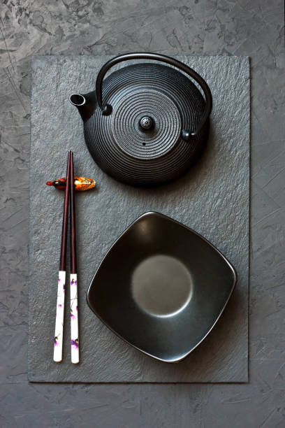 istock Top view  of chopsticks and  dishware   on dark background 1191370877