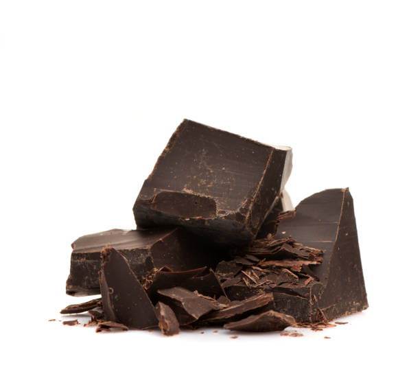 Pieces and chopped chocolate on white background