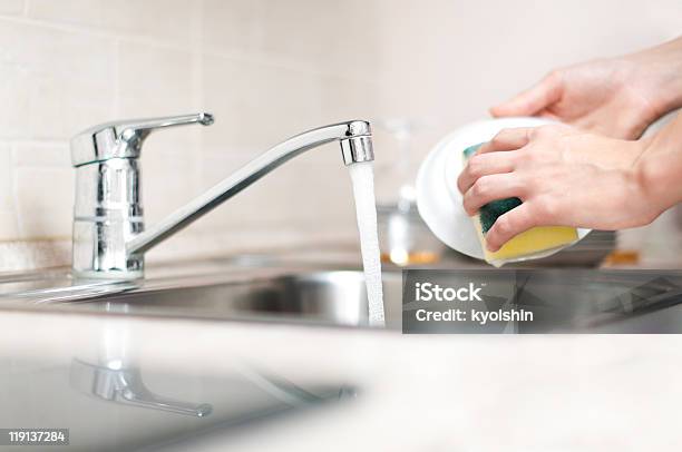 Hands Holding And Washing A Bowl In The Kitchen Sink Stock Photo - Download Image Now