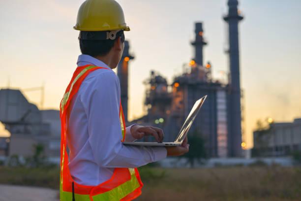 istock Young engineers are using a laptop while working at a large factory. 1191373089