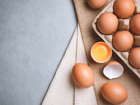 Top view and close up image of  organic chicken eggs are one of the food ingredients on the restaurant table in the kitchen to prepare for cookingwith copy space. Organic chicken eggs food ingredients concept