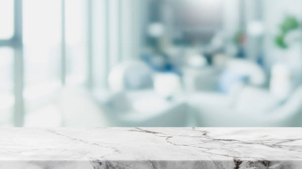 istock Empty white marble stone table top and blur glass window interior restaurant banner mock up abstract background - can used for display or montage your products. 1191378258
