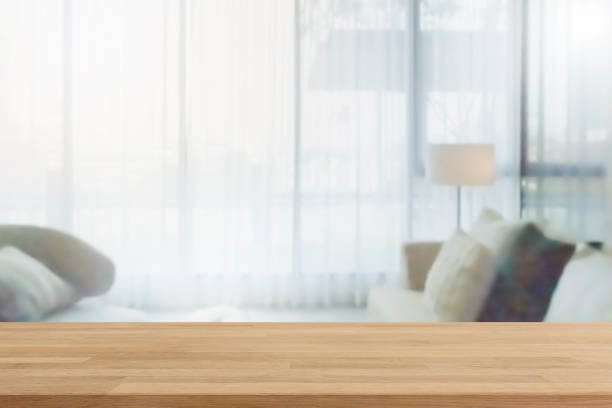 istock Empty wood table top and blurred home interior with curtain window background. - can used for display or montage your products. 1191378265