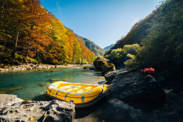 istock Inflatable raft sits on shore of river 1191379293