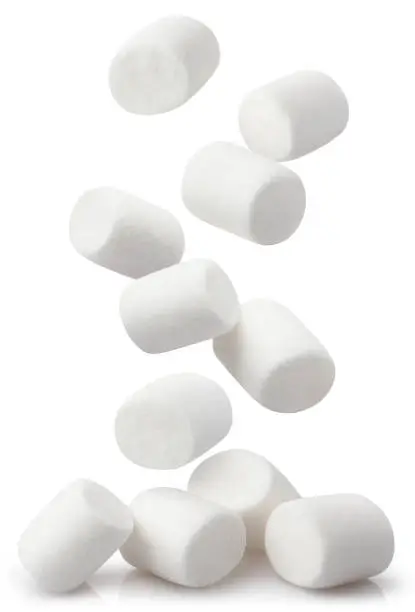 Photo of Falling marshmallows on white