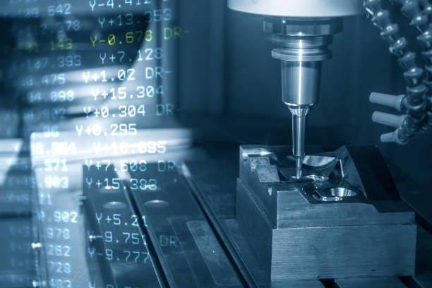 istock The abstract scene of the G-code data  and the CNC milling machine cutting the forging mold parts with solid ball endmill tools. 1191380830