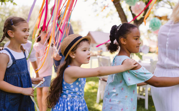 istock Small children walking outdoors in garden in summer, playing. 1191384335