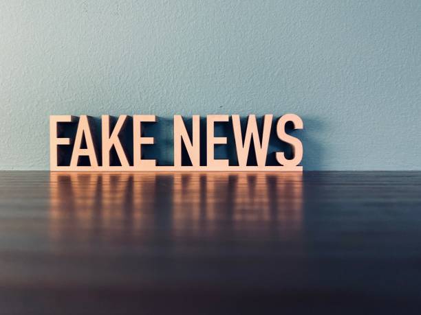 istock Words FAKE NEWS on blue background 1191385480