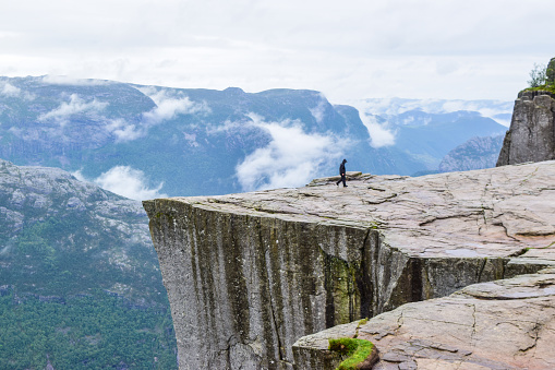 Guy on Prekestolen or Pulpit Rock. Norway.