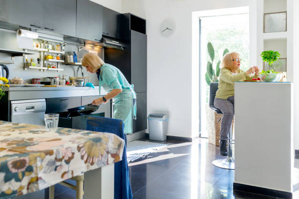 istock Senior women preparing lunch together 1191389275