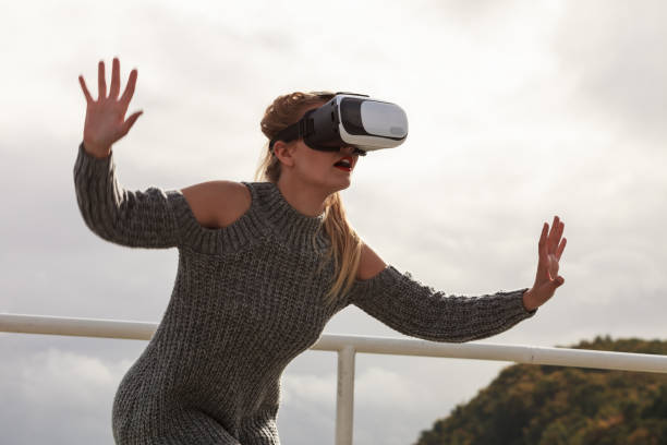 istock Woman wearing VR outside 1191392037
