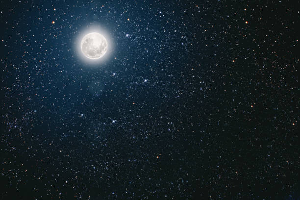 istock backgrounds night sky with stars and moon and clouds. 1191392565