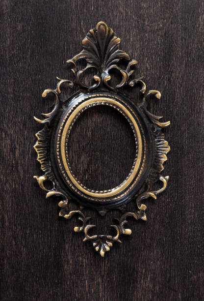 istock Vintage bronze frame on a wooden background, top view 1191393422