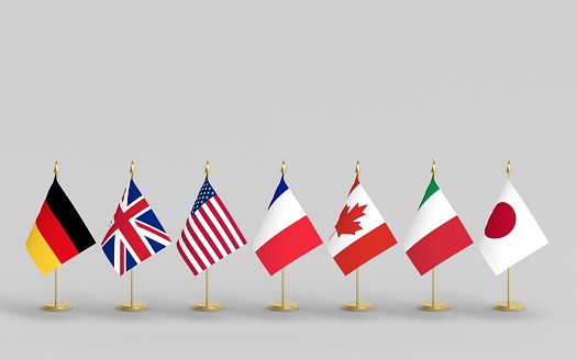 G7 flags, seven table flags on gray background 3d render. Flags of Group of Seven countries:  Canada, France, Germany, Italy, Japan, the United Kingdom, USA.
