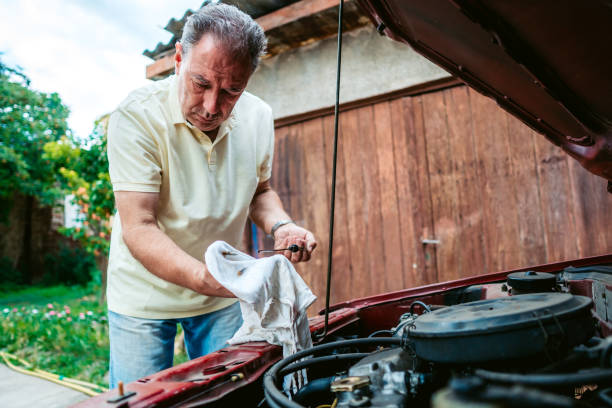 istock Senior man repairing car 1191394114