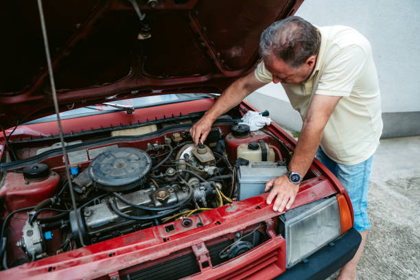 istock Senior man repairing car 1191394304