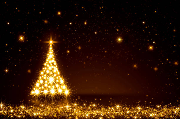 Golden Christmas tree isolated on sky background. stock photo