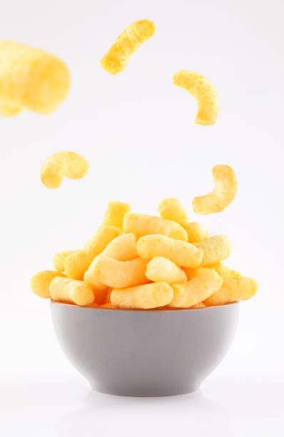 istock puffed corn chips in gray bowl on white background 1191394436