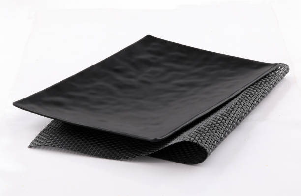 istock empty and clean black plate on white background 1191395118