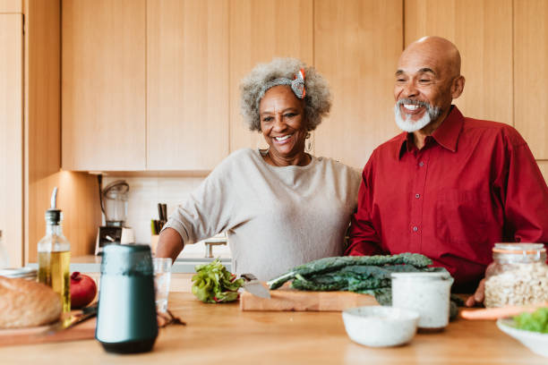 istock Senior couple speaking to smart speaker in the kitchen 1191395158