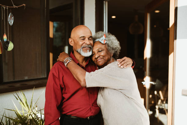 istock Smiling elderly woman embracing husband 1191395223