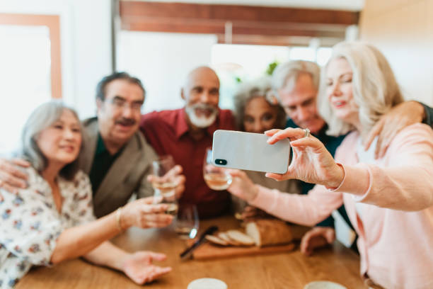 istock Woman taking selfie with friends during brunch 1191395329