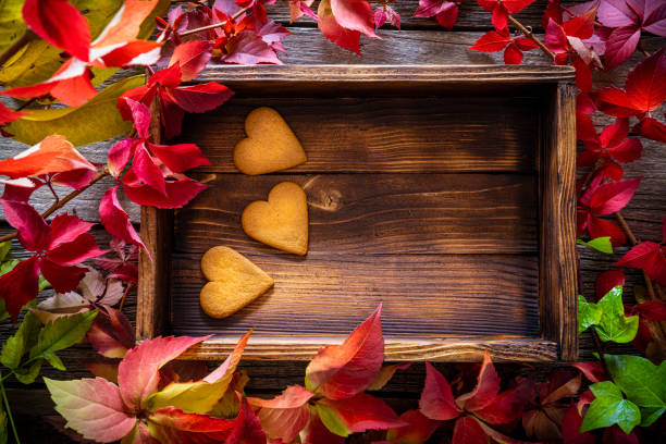 istock Autumn leaves with heart shape gingerbread cookies 1191396685