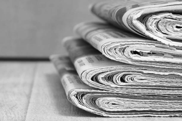 istock Newspapers Folded and Stacked in Pile 1191401023